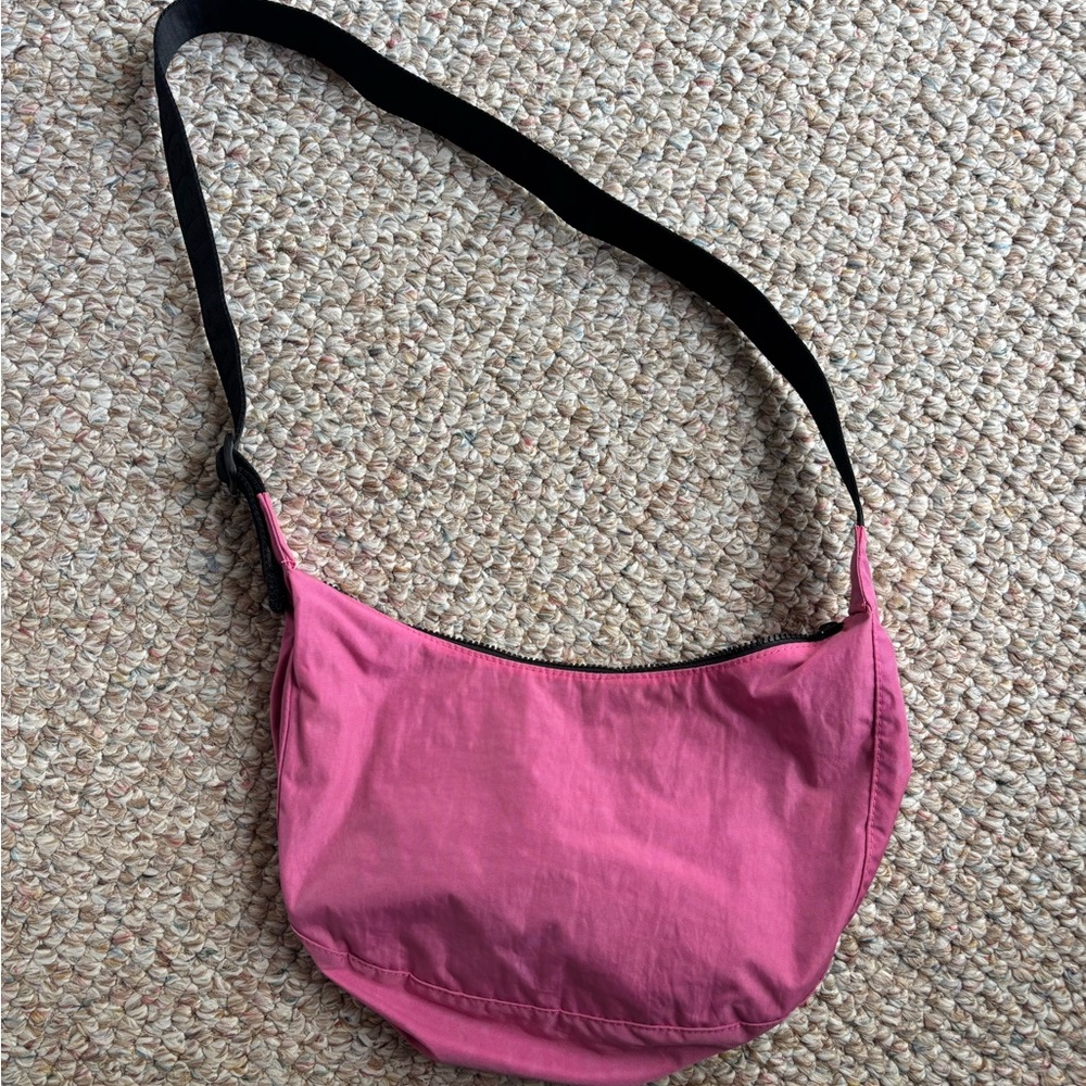 Bright pink Baggu medium sized crescent bag